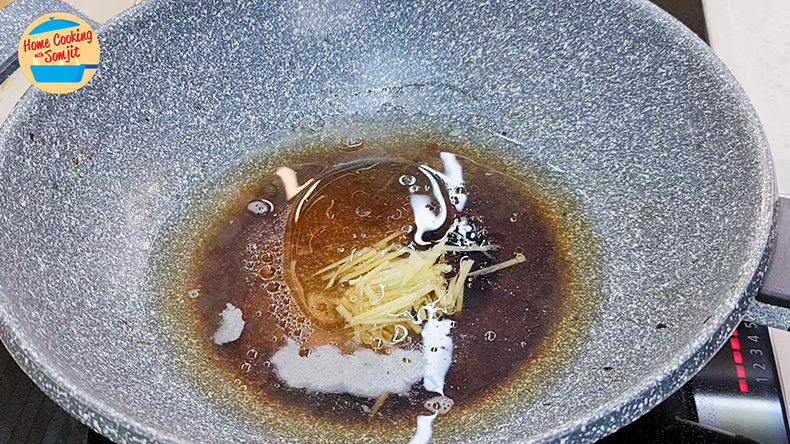 cooking sauce Seasonings and ginger strips cooking in a pan.