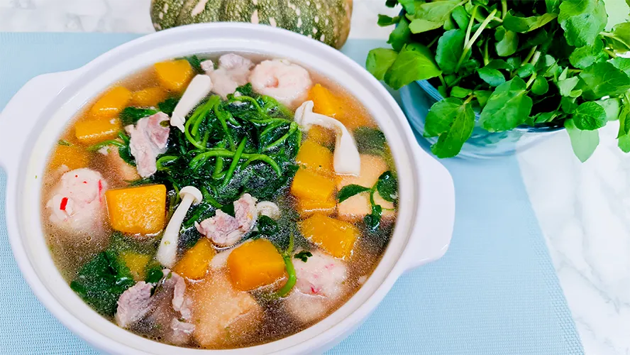 clear pumpkin soup featured Pumpkin Soup with Watercress in a large serving bowl, flanked by pumpkin and watercress.