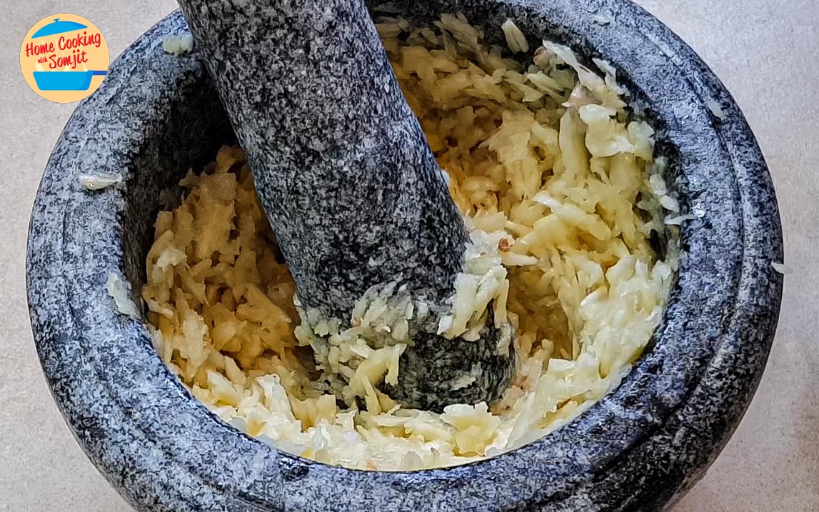 pounded garlic Peeled garlic smashed in a pestle and mortar.