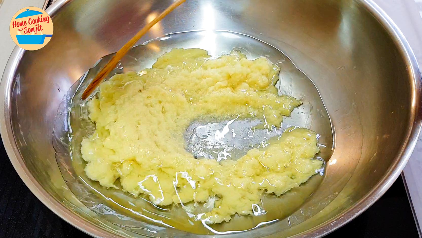 ginger in warm oil Ginger paste in a pan of warm oil.