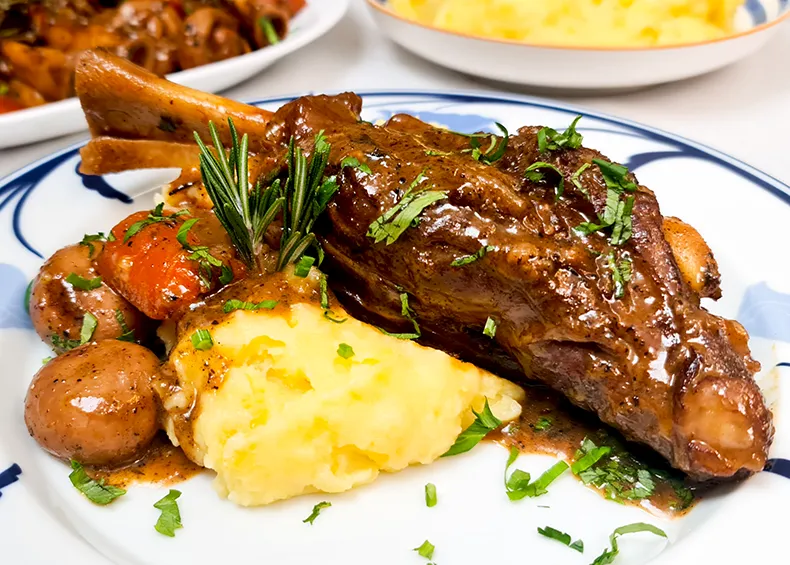 lamb shank zoomed in A close up of the Lamb Shank with Mashed Potatoes.